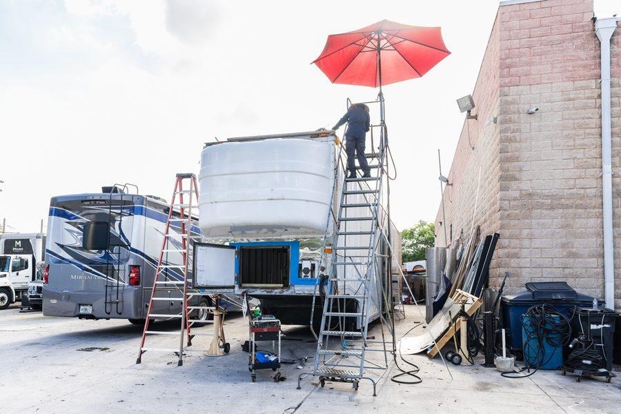 NH Repairs technicians collaborating on truck repair work in Pompano Beach Florida